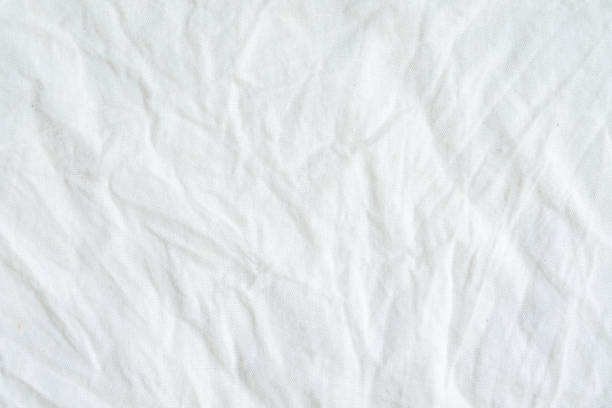 istock Wrinkled white cotton fabric texture background, wallpaper 680337462