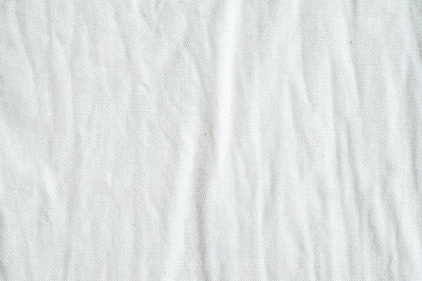 istock Wrinkled white cotton fabric texture background, wallpaper 680337468