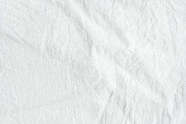 istock Wrinkled white cotton fabric texture background, wallpaper 680337542