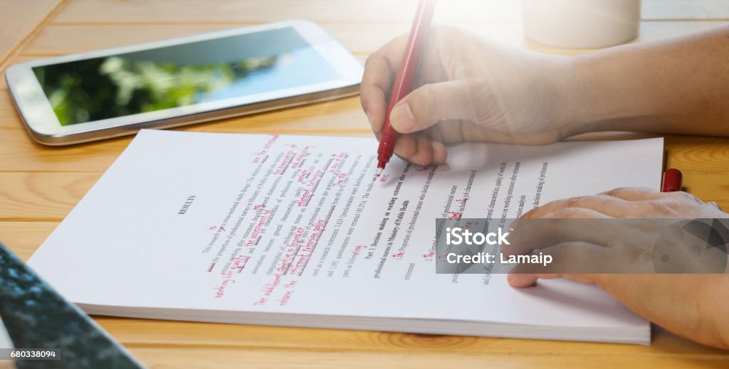 proofread proofreading text on table in office Improvement Stock Photo