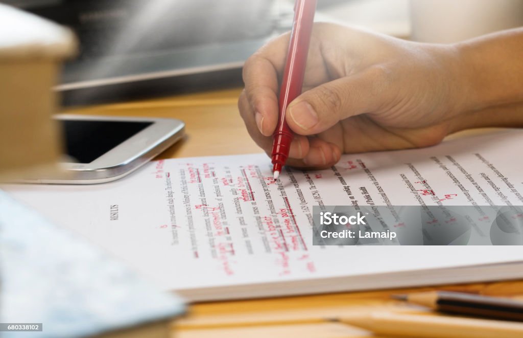 proofread proofreading text on table in office Handwriting Stock Photo