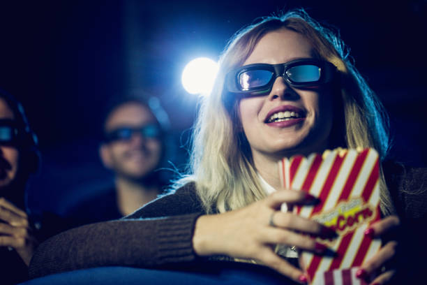 istock Blonde girl in cinema 680343614