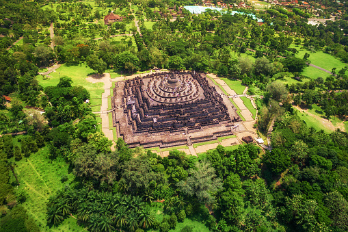 Aerial view of the mandala-shaped Borobudur temple, the world's largest Buddhist monument, in Central Java, Indonesia.