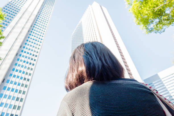 istock Woman looking at office buildings 680358916