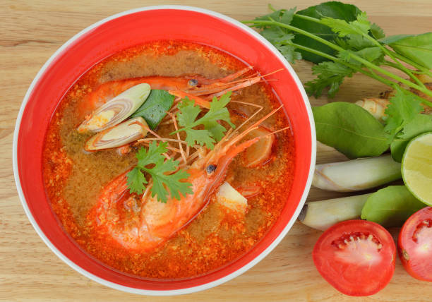istock Tom Yum Kung-Thai spicy soup on wooden table 680358972
