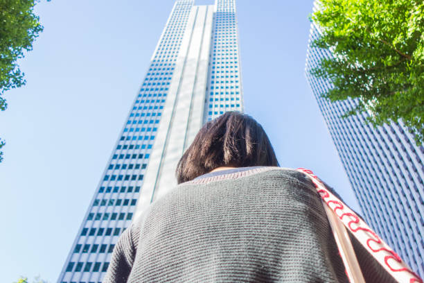 istock Woman looking at office buildings 680358998