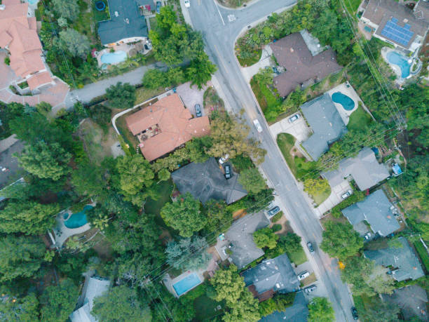 Aerial of Neighborhood An aerial shot of a neighborhood next to the mountains. colorado flag art pictures stock pictures, royalty-free photos & images