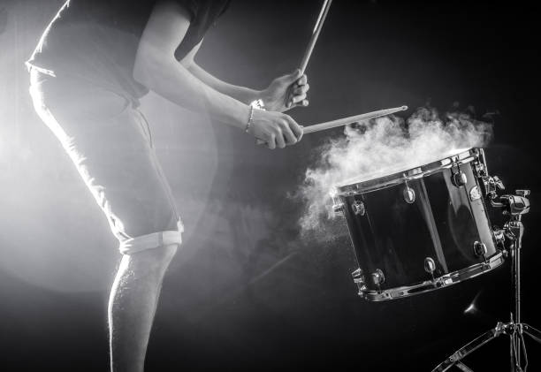 istock man plays musical percussion instrument with sticks, a musical concept, beautiful lighting on the stage 680368414