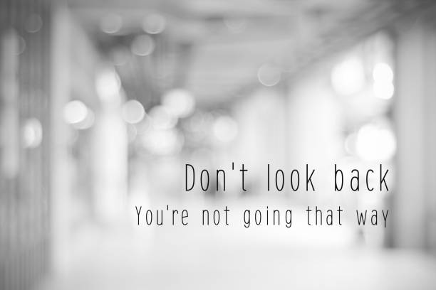 Don't look back, you're not going that way, life quotation on blur abstract black and white bokeh light background Don't look back, you're not going that way, life quotation on blur abstract black and white bokeh light background hope concept stock pictures, royalty-free photos & images