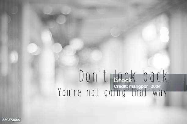 Dont Look Back Youre Not Going That Way Life Quotation On Blur Abstract Black And White Bokeh Light Background Stock Photo - Download Image Now