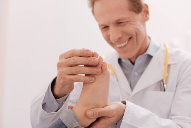 istock Lovely energetic doctor testing his patient 680373650