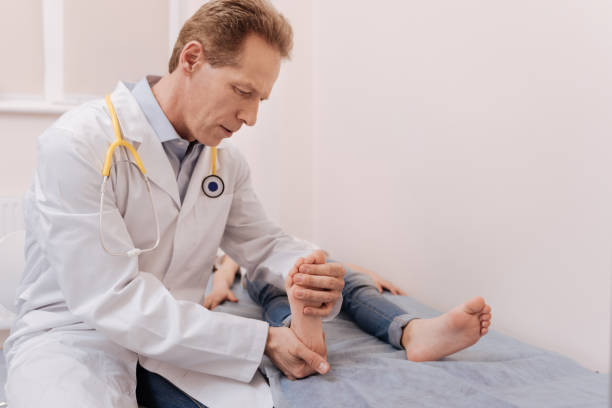istock Qualified dedicated professional treating his patient 680373778
