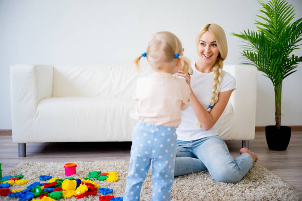istock Mother playing with her baby daughter 680374506