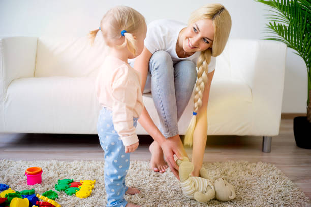 istock Mother playing with her baby daughter 680374574