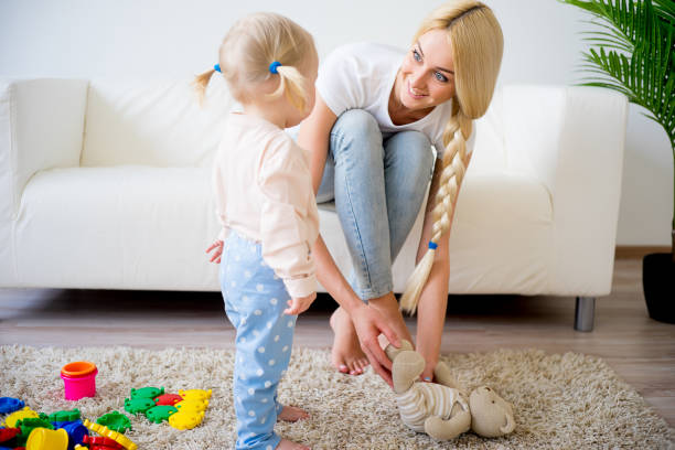 istock Mother playing with her baby daughter 680374626