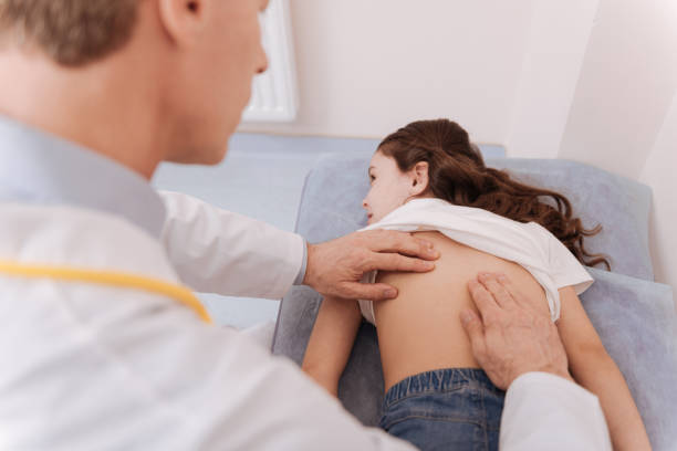 istock Lovely young lady having her spine checked 680374942