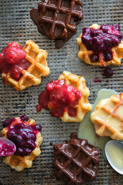 istock Mini Belgium Waffles with Chocolate, Vanilla, Blueberry and Strawberry Toppings 680377812