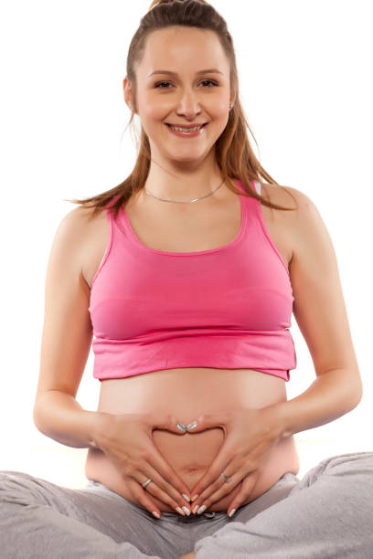 istock pregnant woman in sitting position 680384064