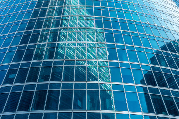 istock Abstract business background. Reflection on office building windows 680385438