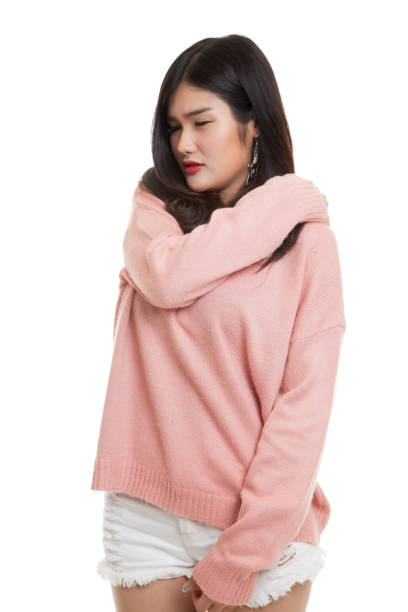 istock Young Asian woman got back pain. 680387188