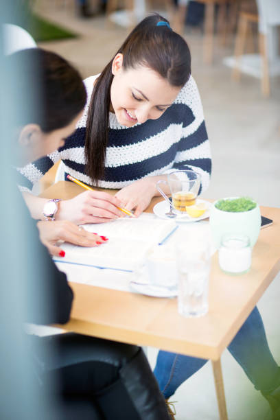istock Student girls enjoy a coffee break 680387726
