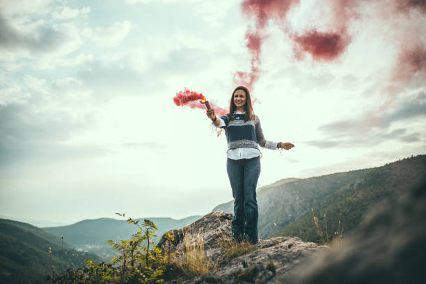 istock Woman on mountain with torch 680389842