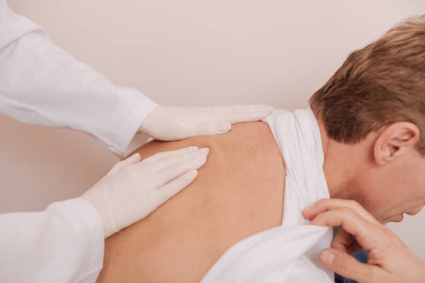 istock Good delicate rheumatologist massaging patients upper back 680392022