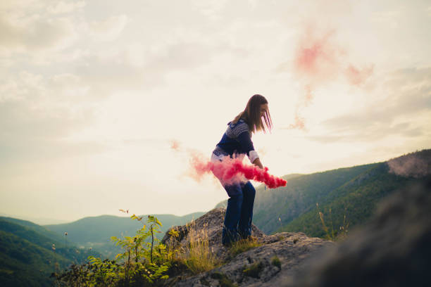 istock Girl in nature with torch 680392342