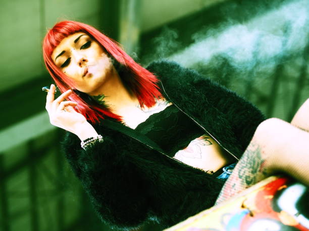 istock smoking girl portrait 680392452