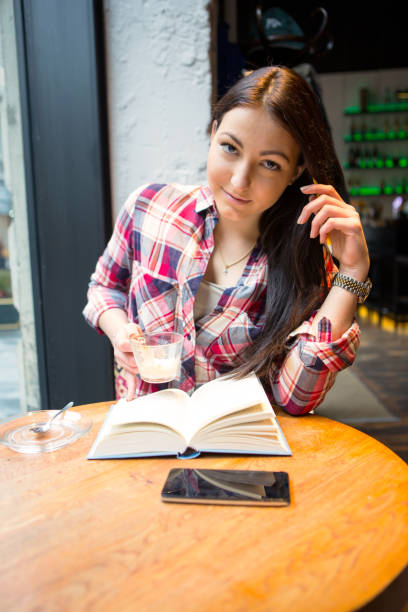 Student girl enjoy a coffee break.