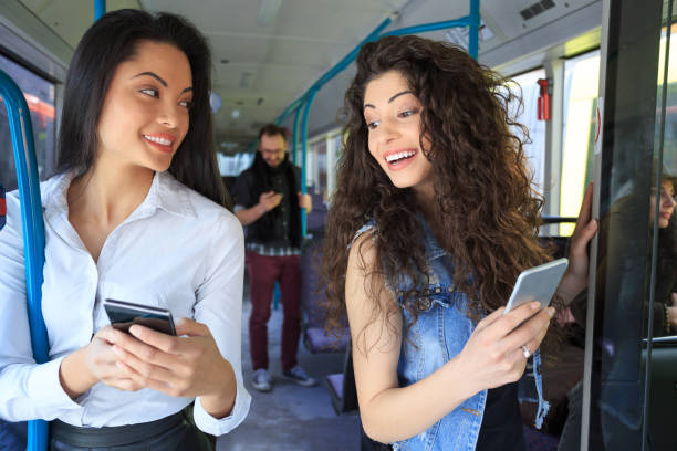 istock Two beautiful women talking in a bus 680393294
