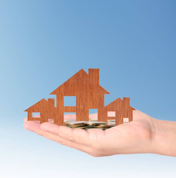 istock Mortgage concept by house from in  hand 680396758