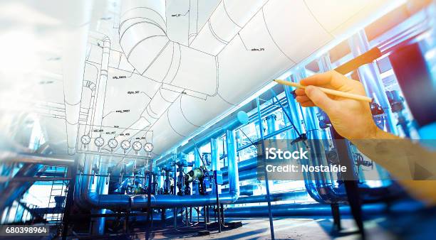 Mans Hand Draws A Design Of Factory Stock Photo - Download Image Now - Engineer, Pipe - Tube, Engineering