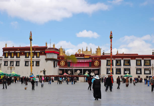 LHASA, CHINA - APRIL 12, 2009 : Pilgrims and Tourists at Jokhang Temple in Lahas, Tibet. Jokhang temple is located on Barkhor Square in Lhasa, Tibet. It is the most sacred and important temple in Tibet