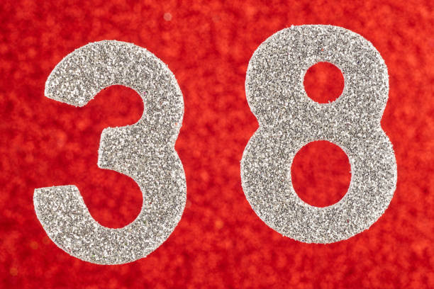 istock Number thirty-eight silver color over a red background. Anniversary. 680402028