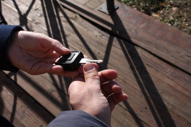 istock Buyer's hand taking a car key. 680402906