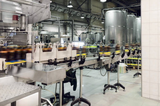 istock Plastic bottles with beer on the conveyor 680403594