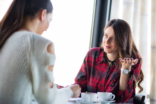 istock Two girl enjoy a coffee break. 680408466