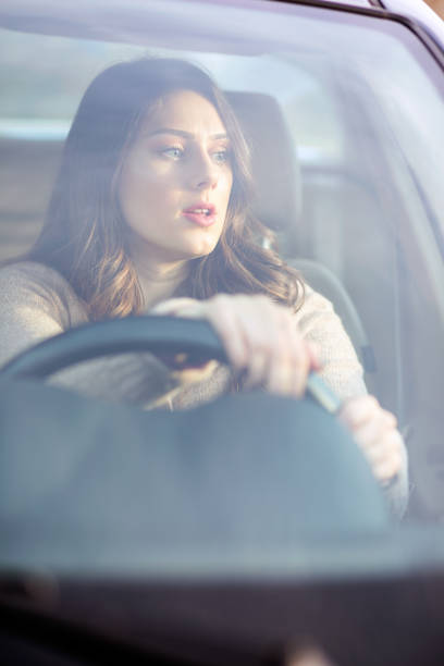 istock Beautiful girl driving a car. 680409828