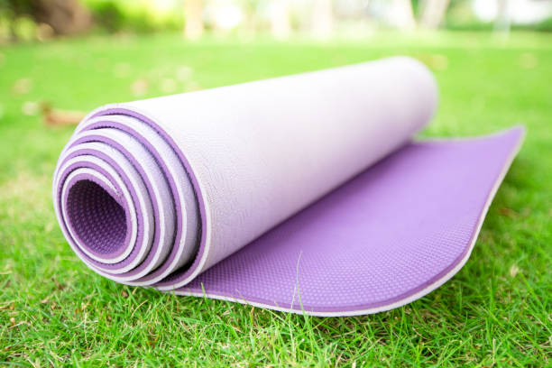istock Close-up of rolled exercise mat on backyard 680410044