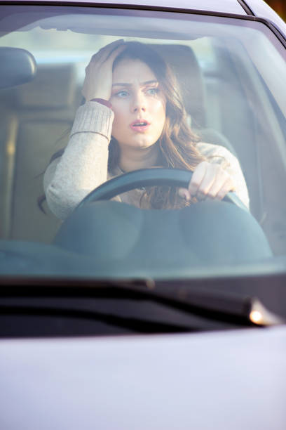istock Beautiful girl driving a car. 680410170