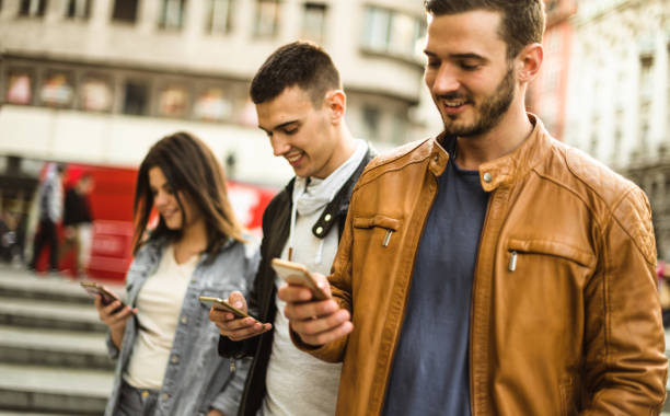 istock group of friends doing social networking 680411316