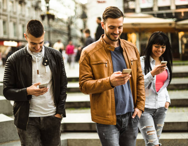 istock group of friends doing social networking 680411520