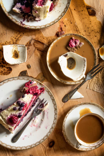 Coffee table desaster, broken cup and smashed torte