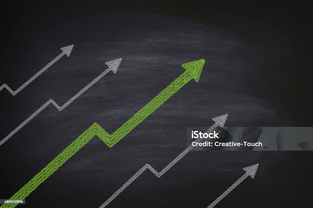 Increase in stocks on blackboard Moving Up Stock Photo