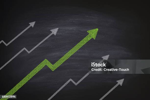 Increase In Stocks On Blackboard Stock Photo - Download Image Now - Moving Up, Arrow Symbol, Stock Market Data