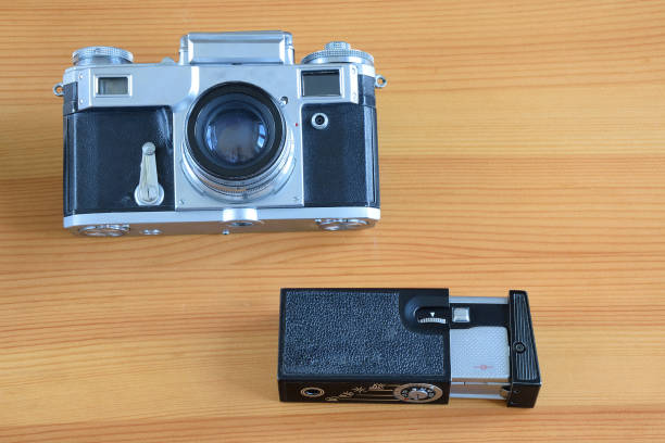 istock Old cameras on a wooden table. 680424166