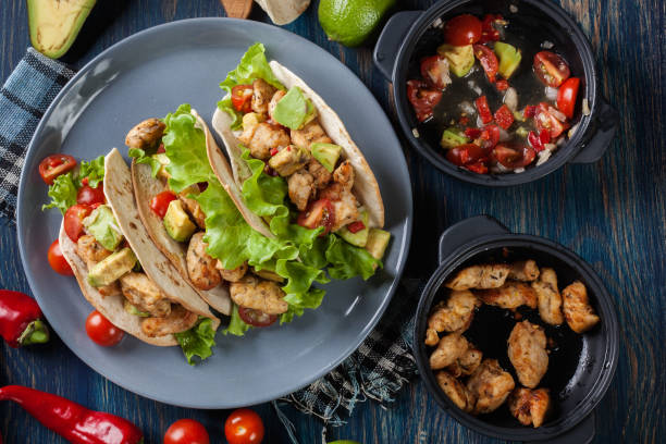 istock Authentic mexican tacos with chicken and salsa with avocado, tom 680427568