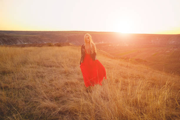 istock Happy woman enjoying nature sunse 680427720