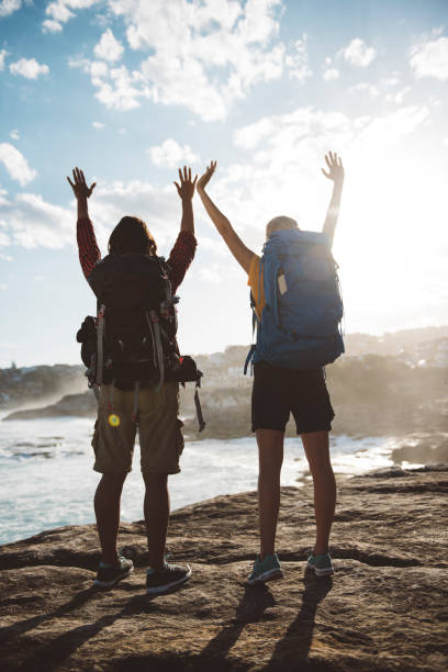 istock Raised arms by girl hikers 680431250